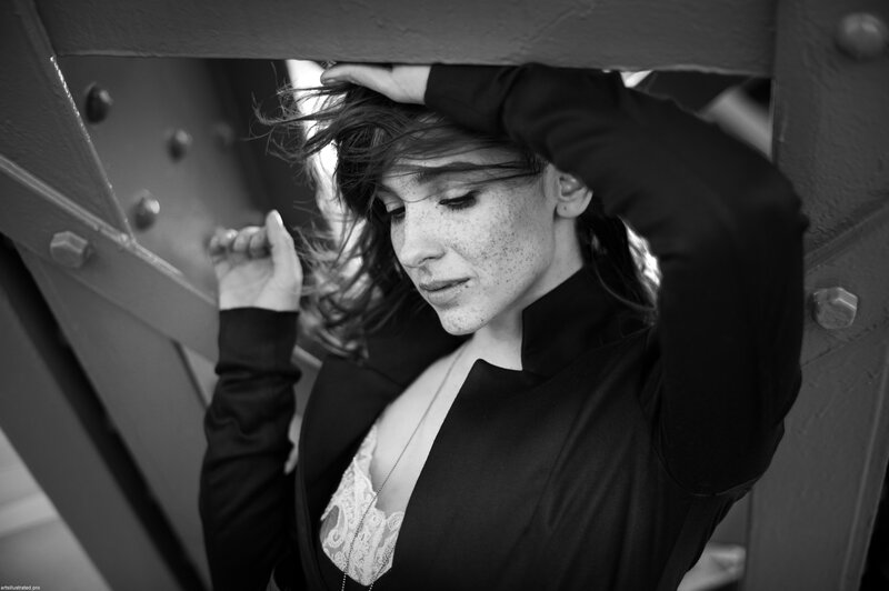 woman with freckles in black and white