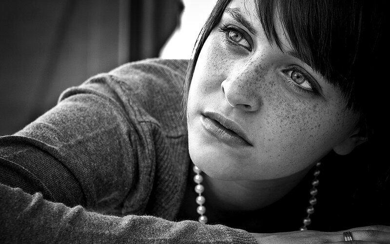 woman with freckles in black and white