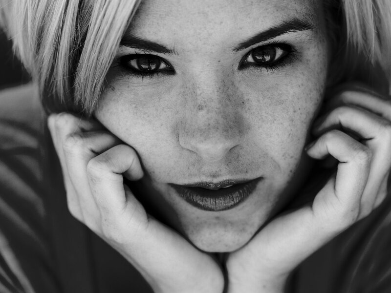 woman with freckles in black and white