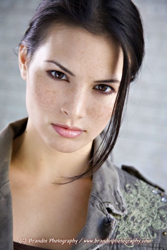 woman with freckles in jacket