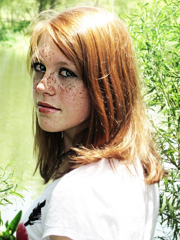 woman with freckles in nature
