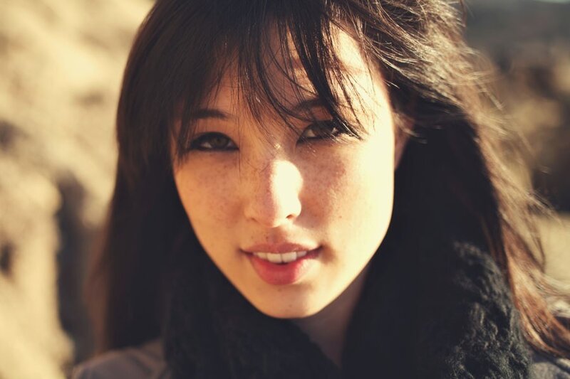 woman with freckles in sunlight