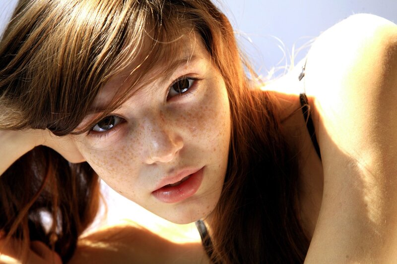woman with freckles in sunlight