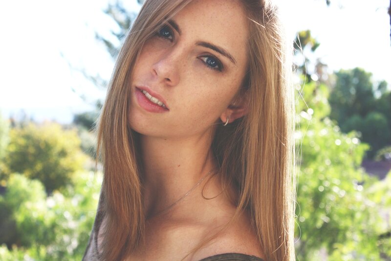 woman with freckles in sunlight