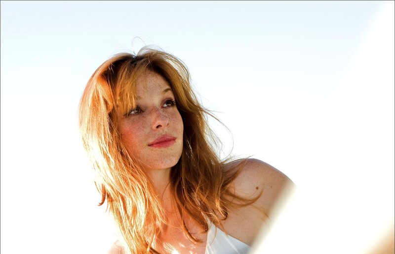 woman with freckles in sunlight