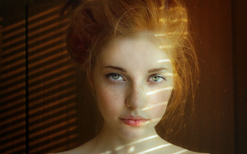 woman with freckles in sunlight
