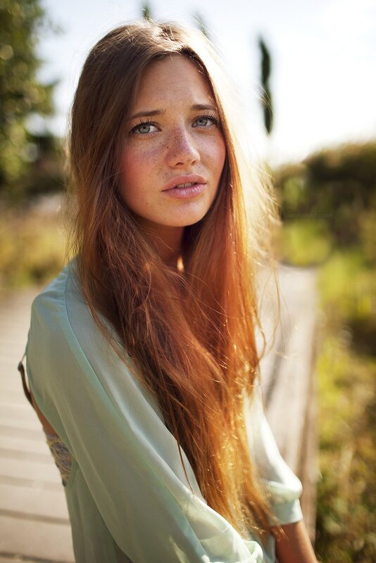 woman with freckles in sunlight