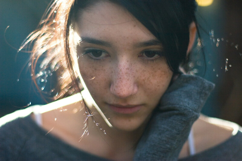 woman with freckles in sunlight