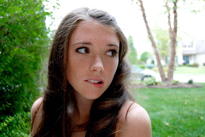 woman with freckles outdoors