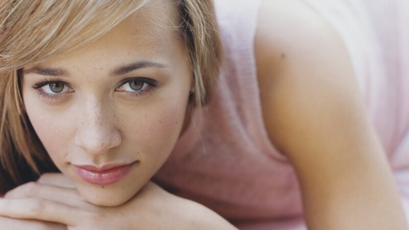 woman with freckles resting