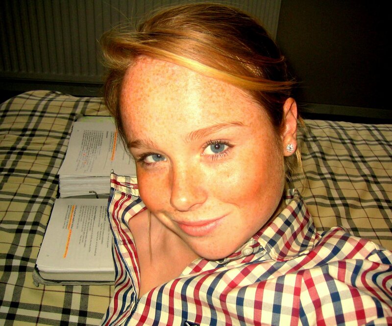 woman with freckles smiling