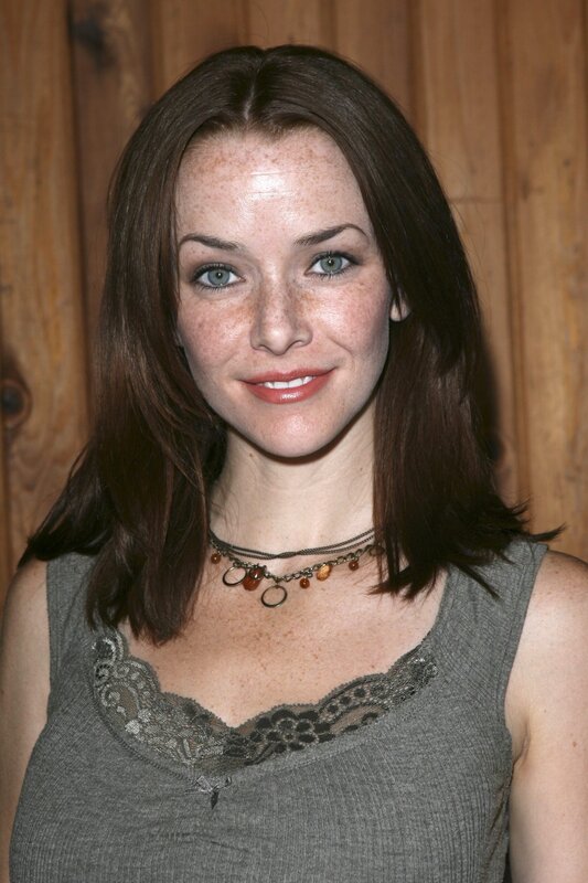 woman with freckles smiling