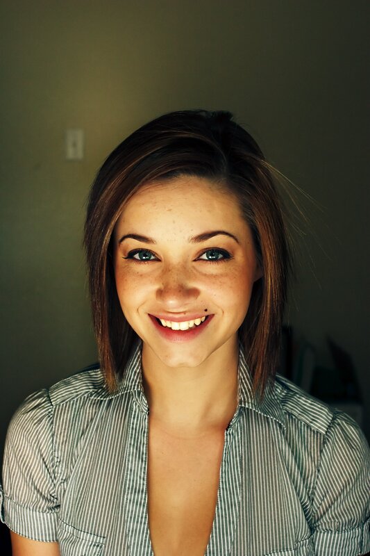 woman with freckles smiling