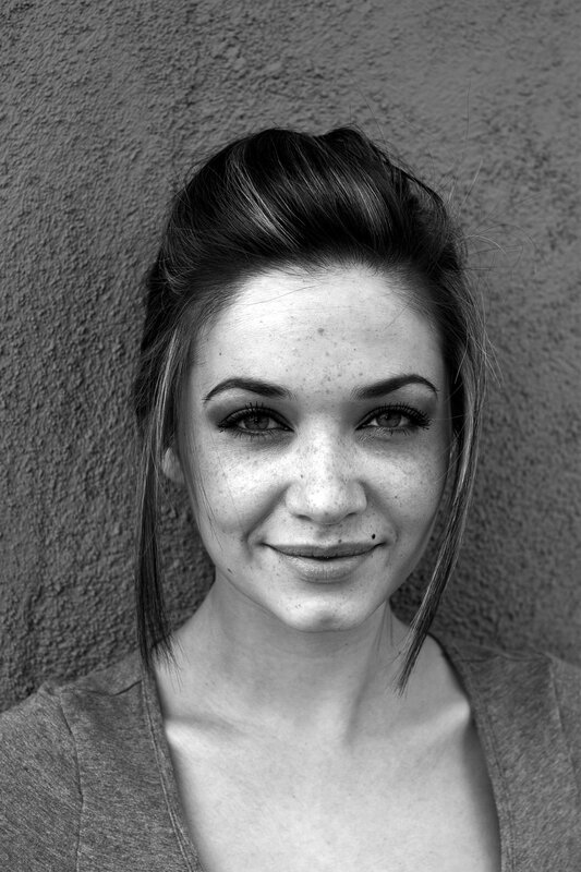 woman with freckles smiling