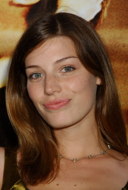 woman with freckles smiling