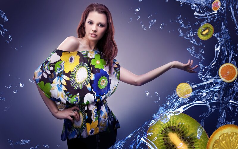 woman with fruit and water splash