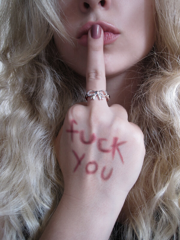 woman with 'fuck you' on hand