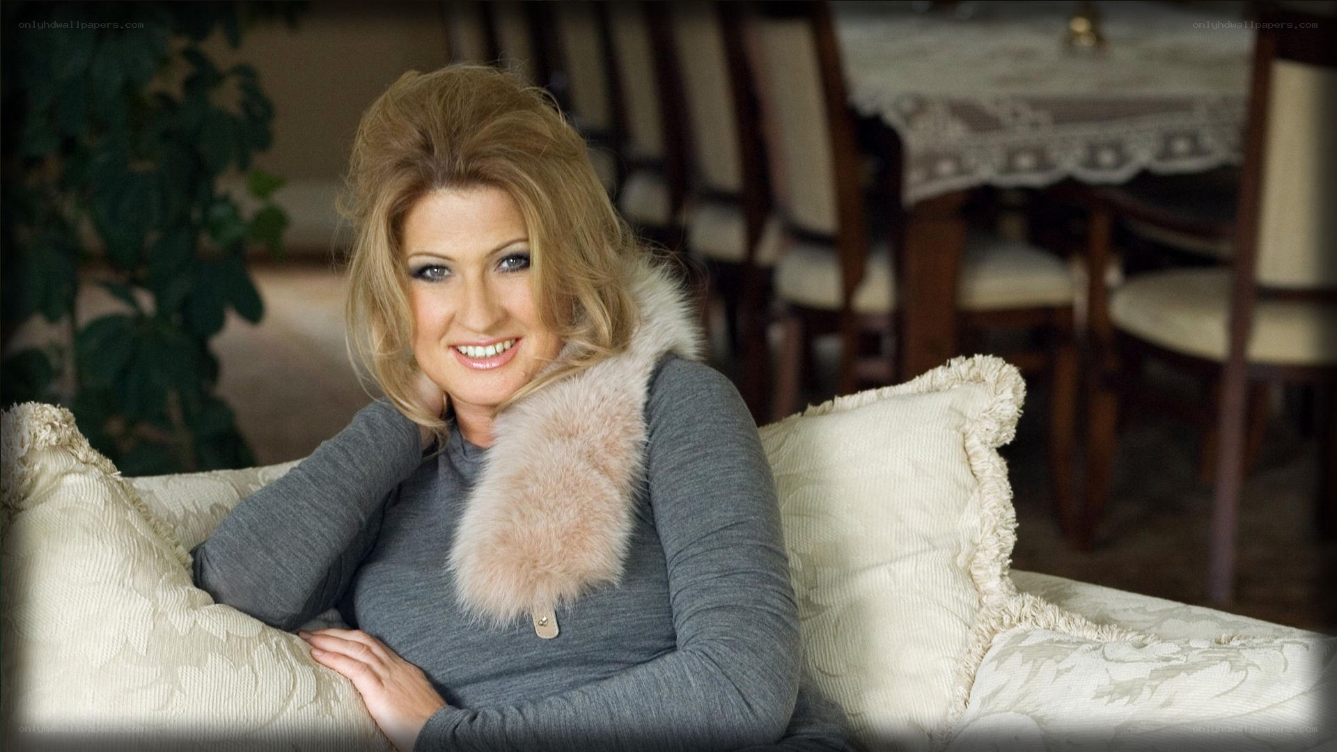 woman with fur collar smiling
