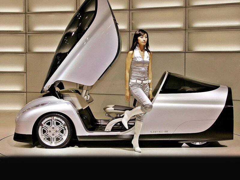 Woman with futuristic concept car