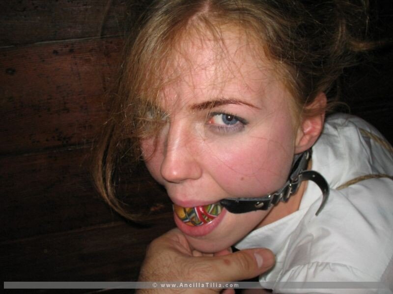 woman with gag in mouth