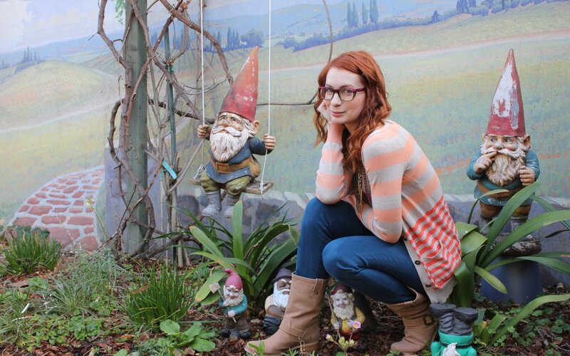 Woman with garden gnomes