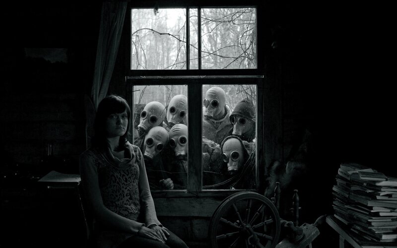 Woman with gas masks outside window