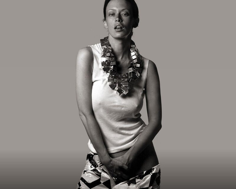 woman with geometric necklace