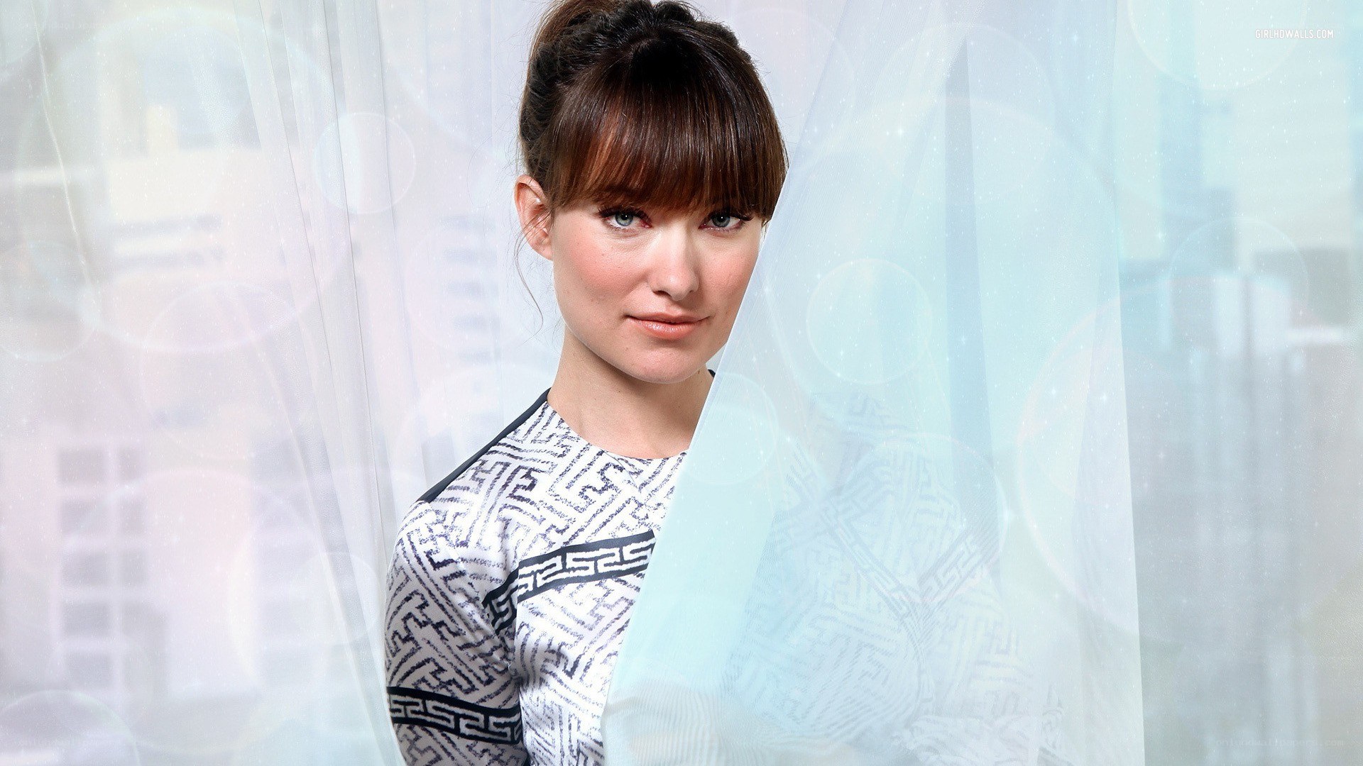 woman with geometric patterned top