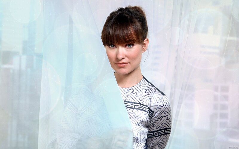woman with geometric patterned top