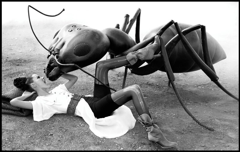 woman with giant ant sculpture