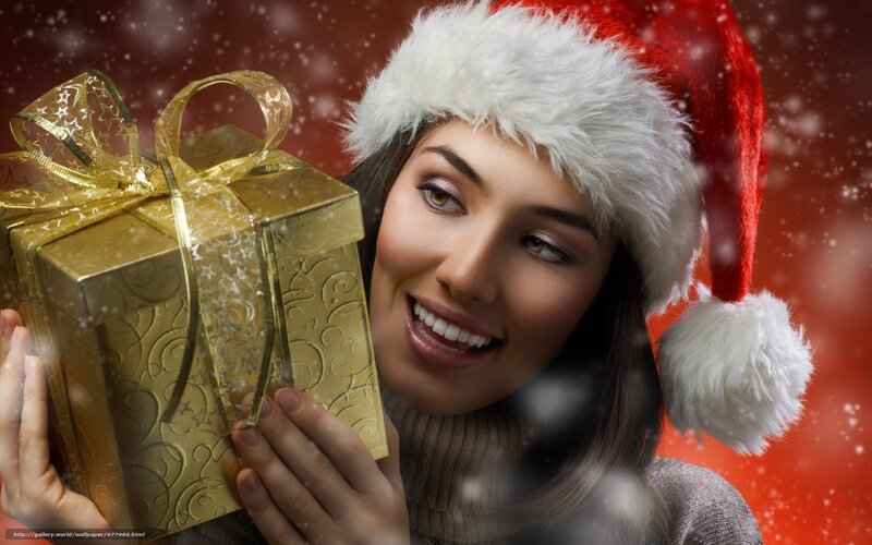 woman with gift and santa hat