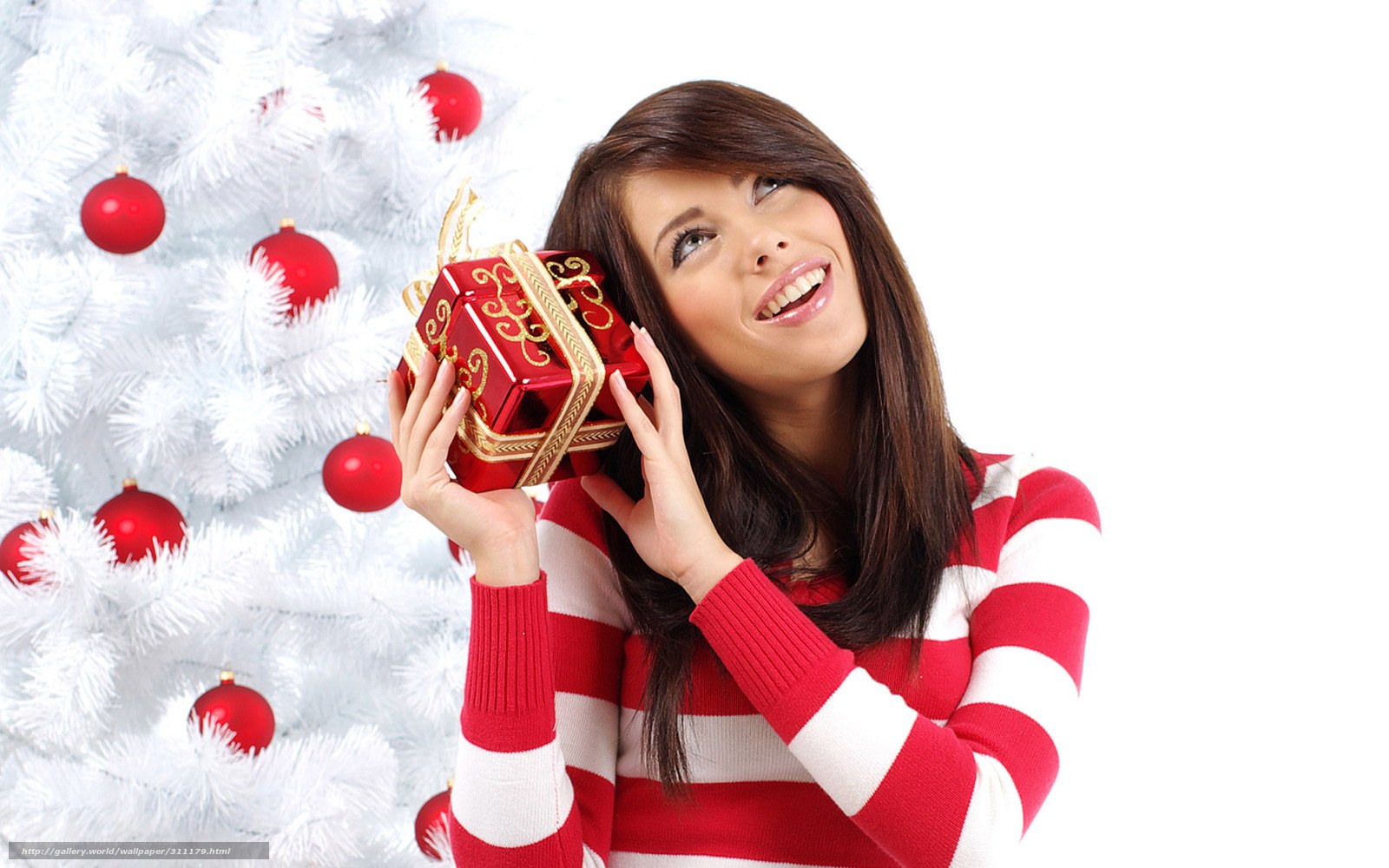 woman with gift near white tree