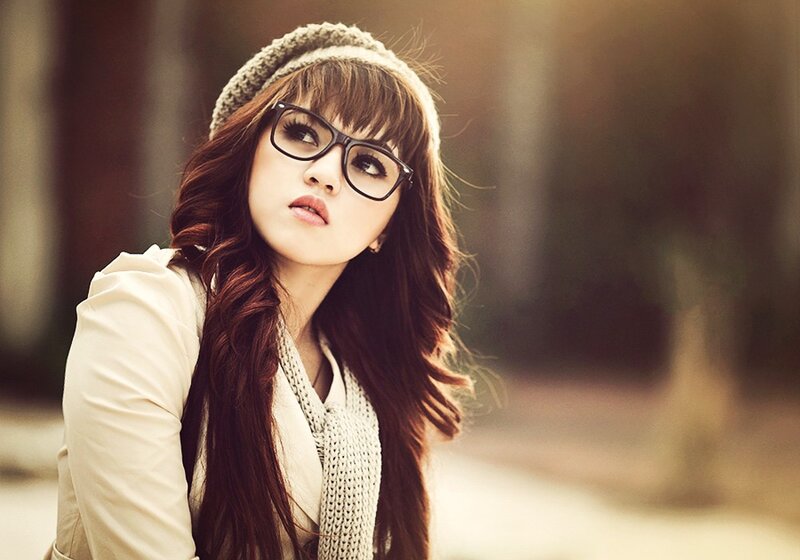 woman with glasses and beanie