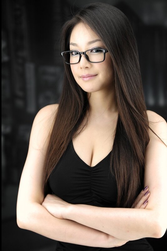 woman with glasses and black top