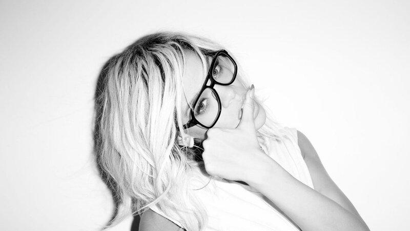 woman with glasses and blonde hair