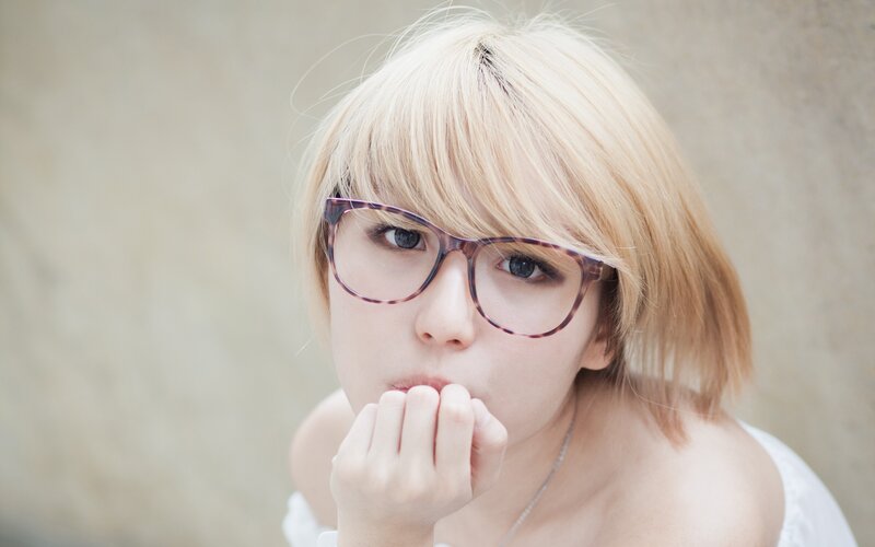 woman with glasses and blonde hair