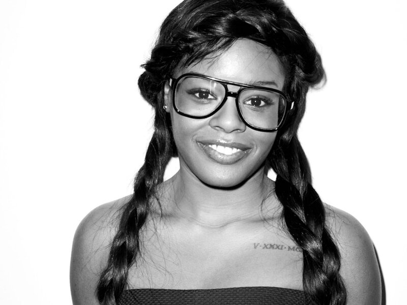 woman with glasses and braids