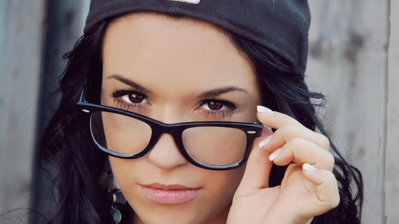 woman with glasses and cap