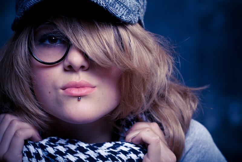 woman with glasses and cap