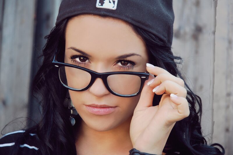 woman with glasses and cap