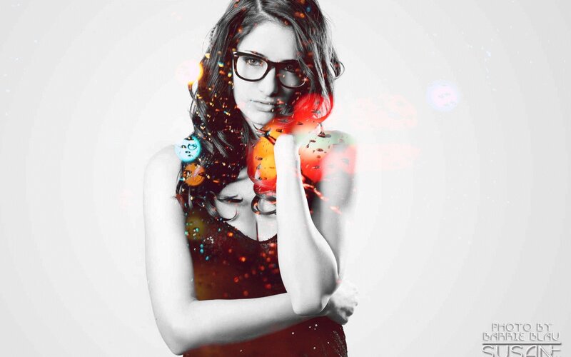 woman with glasses and colorful effects