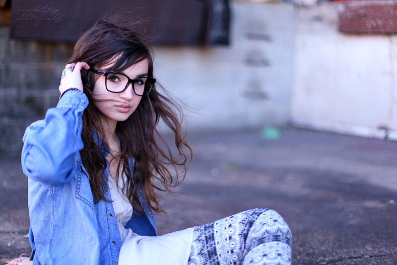 woman with glasses and denim