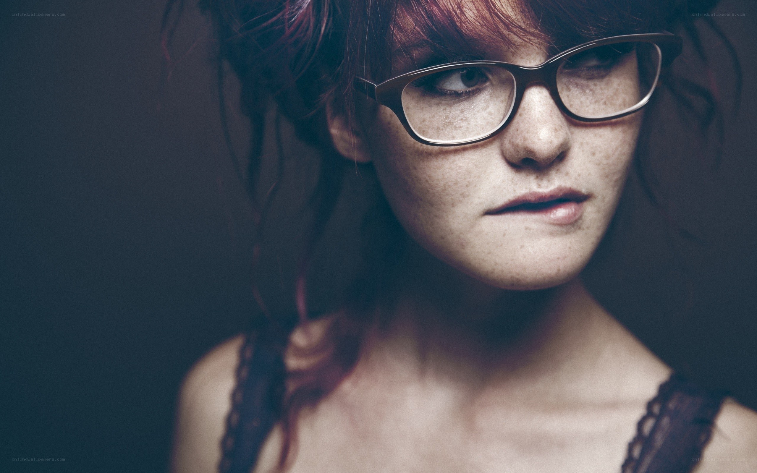 woman with glasses and freckles