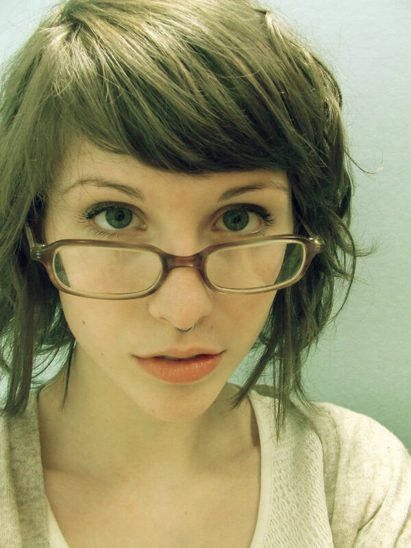 woman with glasses and nose ring