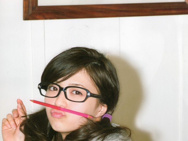 woman with glasses and pencil