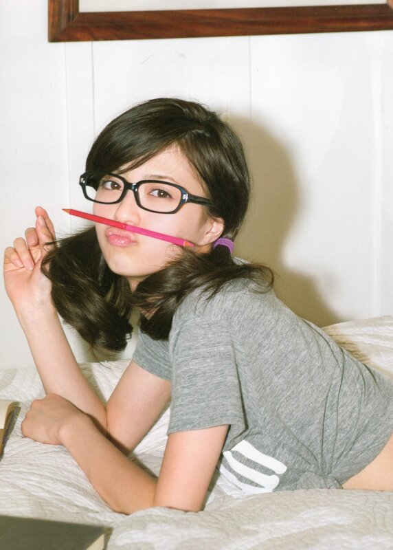 woman with glasses and pencil