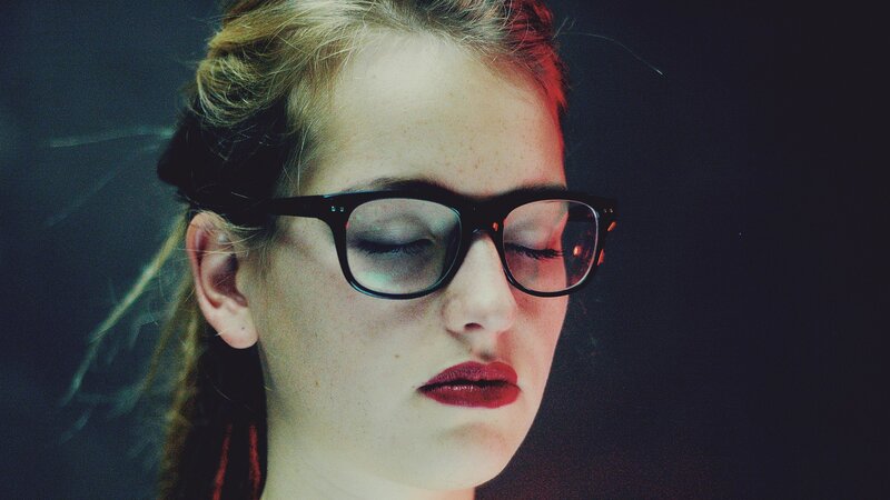 woman with glasses and red lipstick