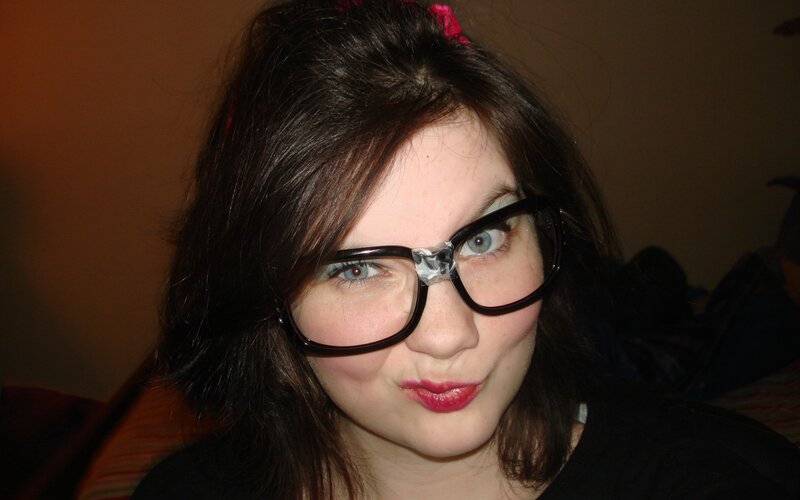 woman with glasses and red lipstick