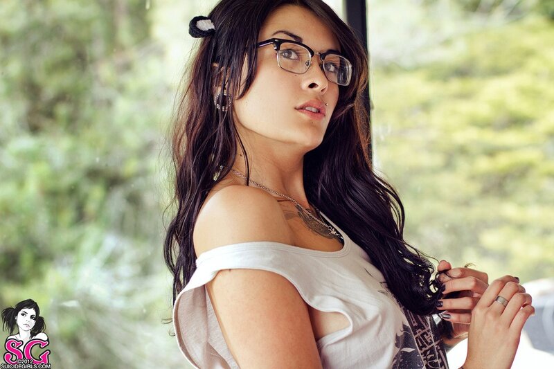 woman with glasses and tattoo