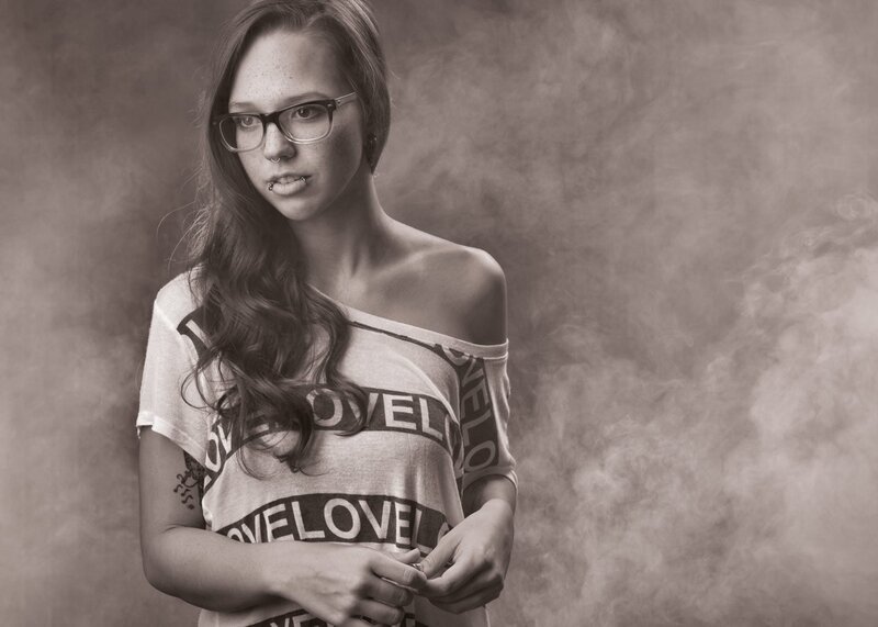 woman with glasses and tattoos
